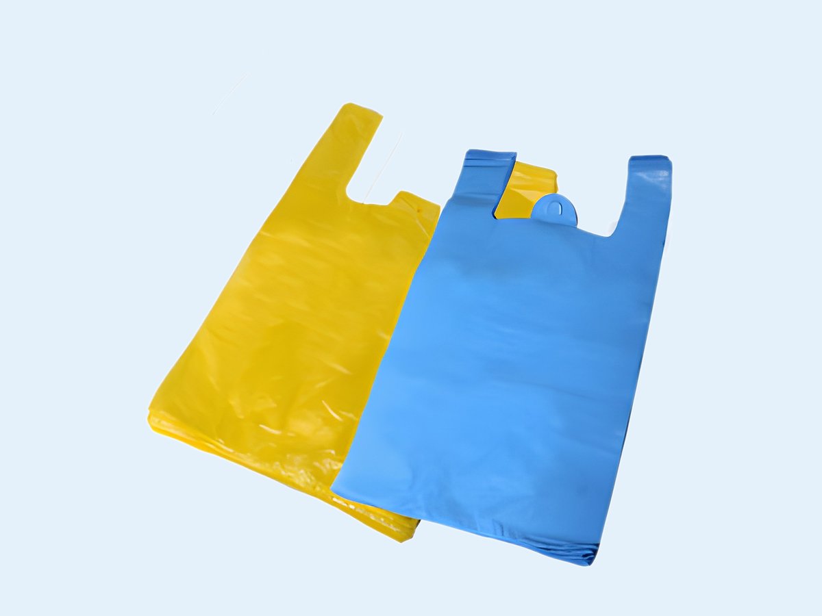 Sacs plastique à bretelles blanc, jaune et bleu